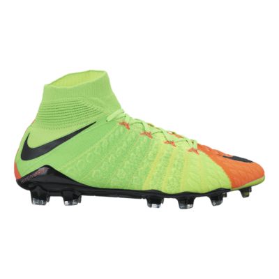 green and orange nike cleats