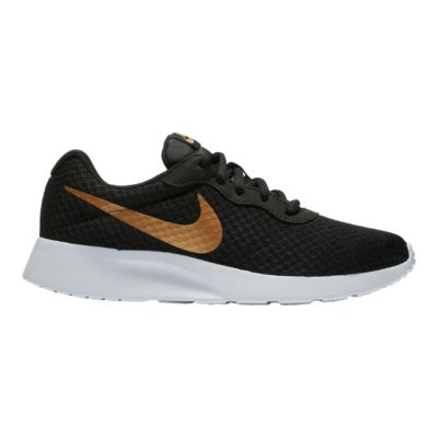 nike shoes black gold