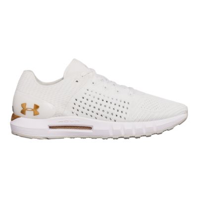 gold and white under armour shoes