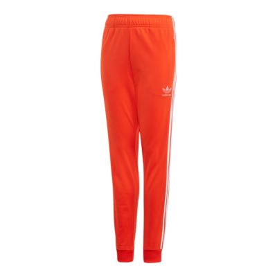 orange and white adidas pants